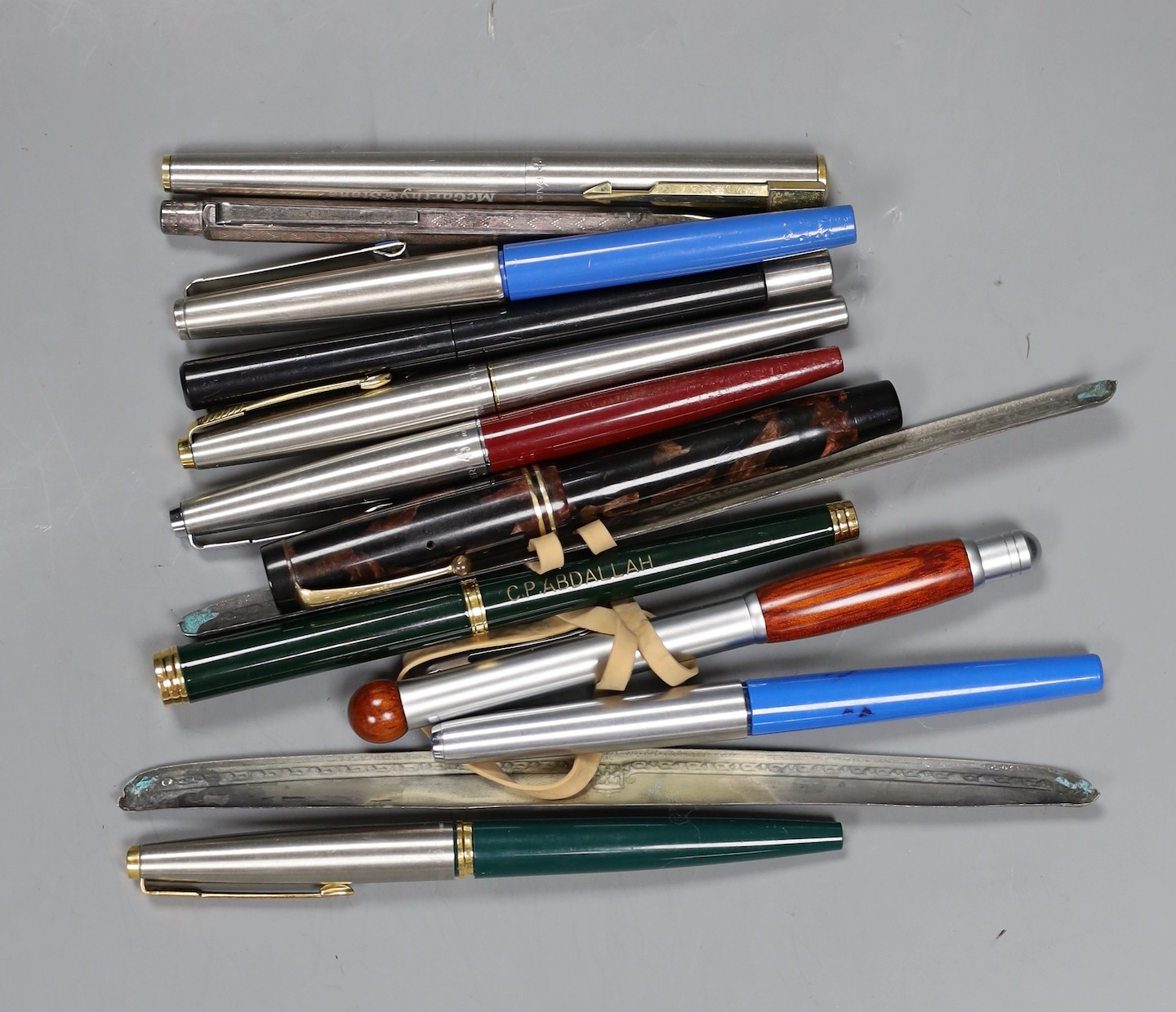 A quantity of assorted pens and sterling silver dressing table items